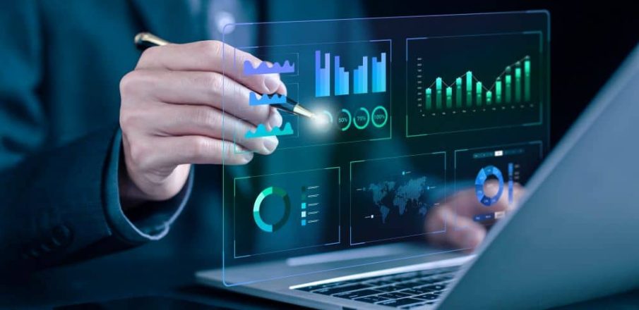 Analytique en action: un professionnel manipule une interface holographique affichant graphiques et diagrammes sur un laptop, illustrant automatiser des tâches avec chatgpt.